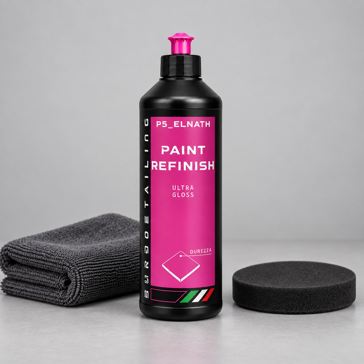 Eurodetailing Paint Refinish bottle beside a microfibre cloth and polishing pad.